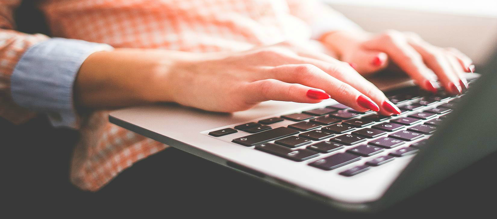 Jobseeker typing on laptop